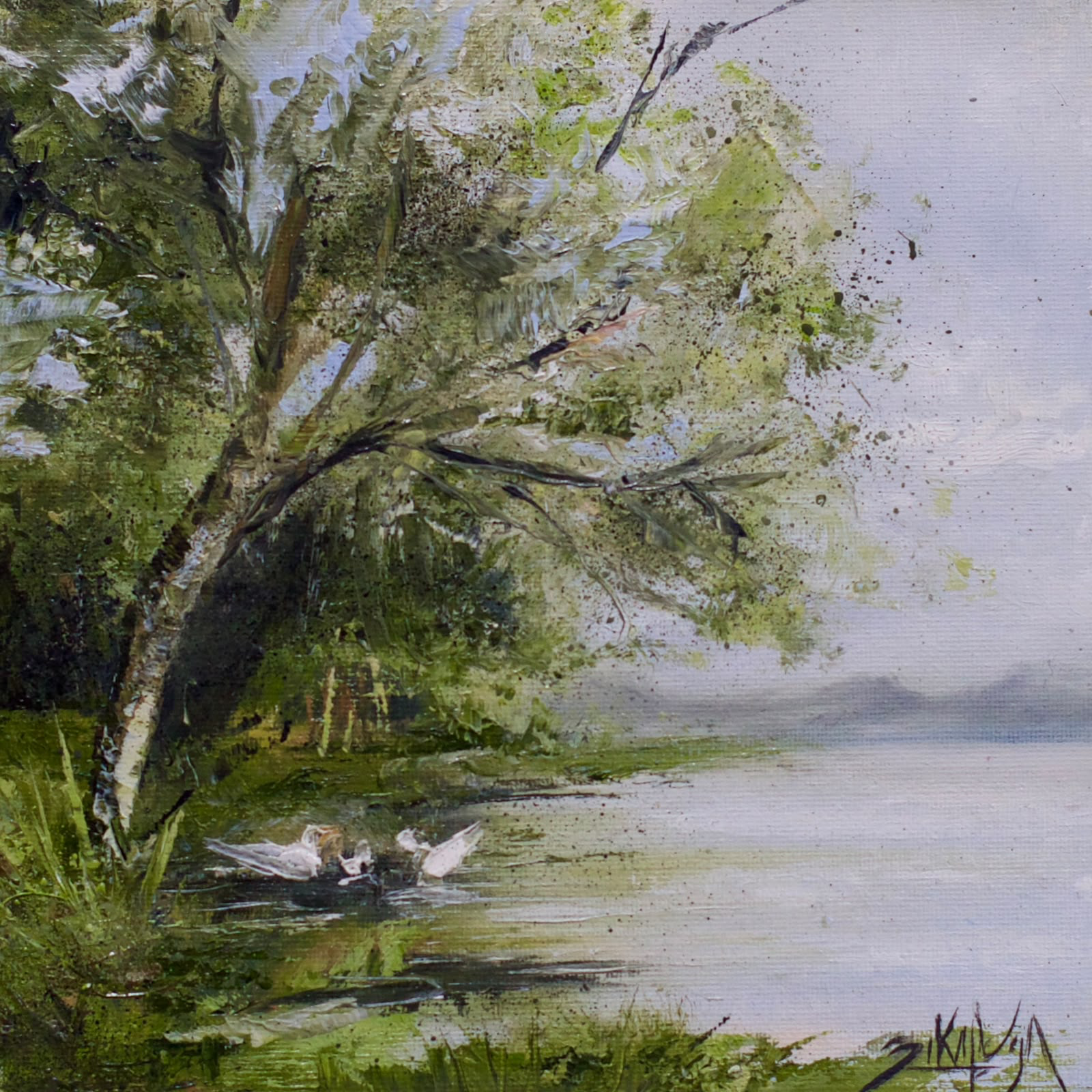 Trees and white birds by a lake